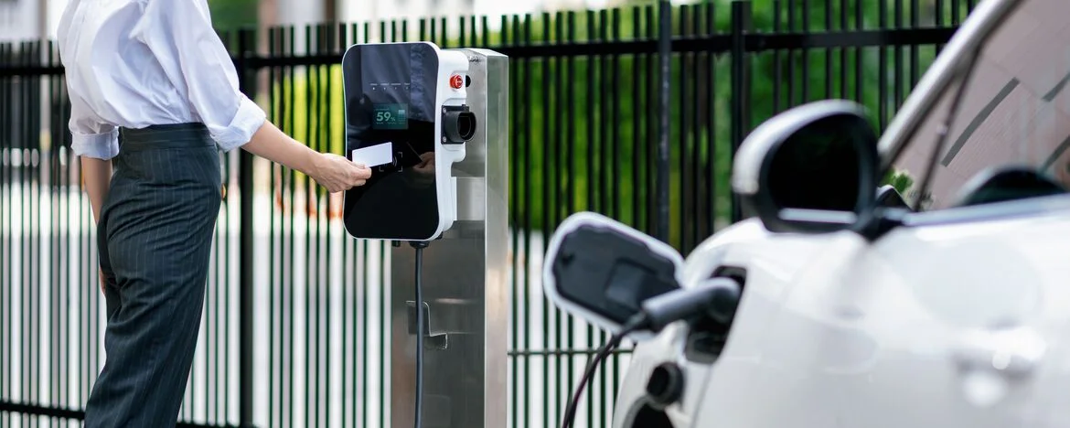 Man charging an electric car