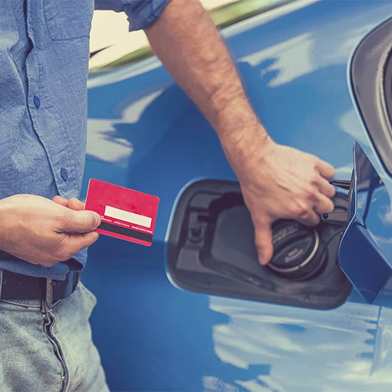 person with fuel card opening a fuel tank